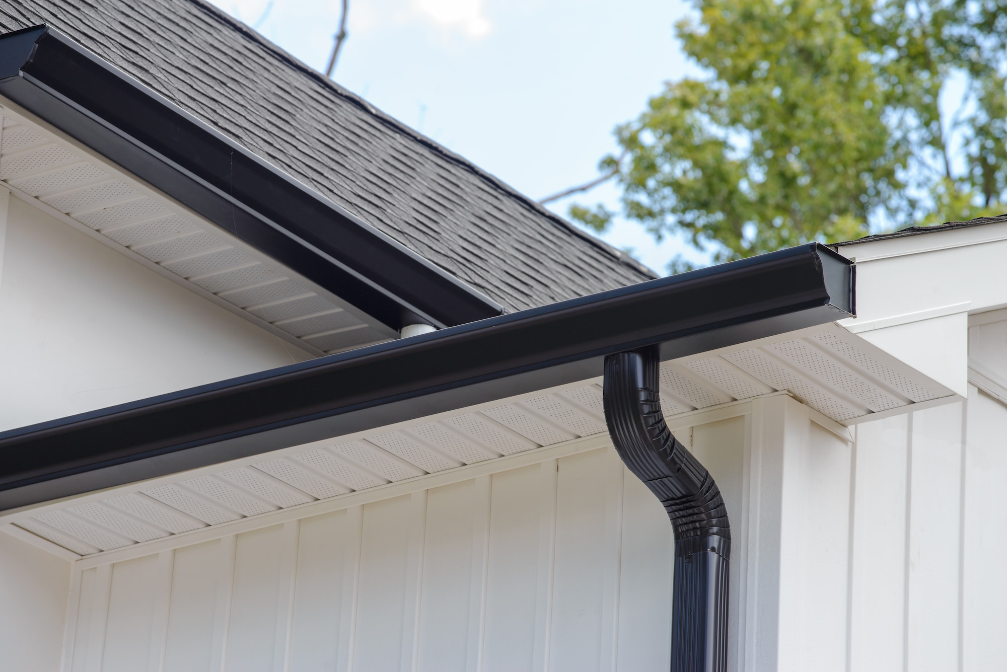 A black gutter on a white home.